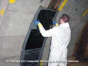 The CarbonSeal carbon fiber is applied to the prepared walls.