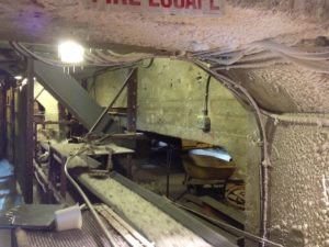 Interior of mine showing significant efflorescence, spalling, and structural degradation.